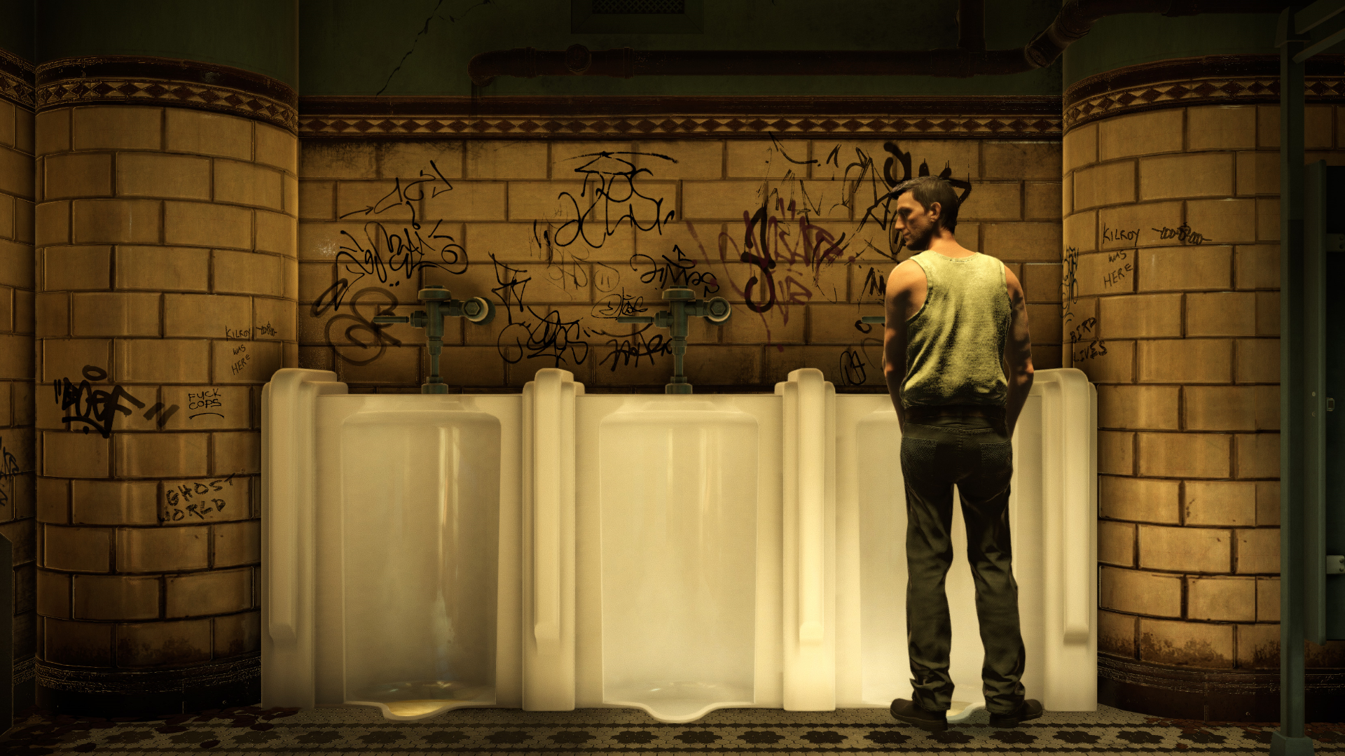 A man stands at a urinal.